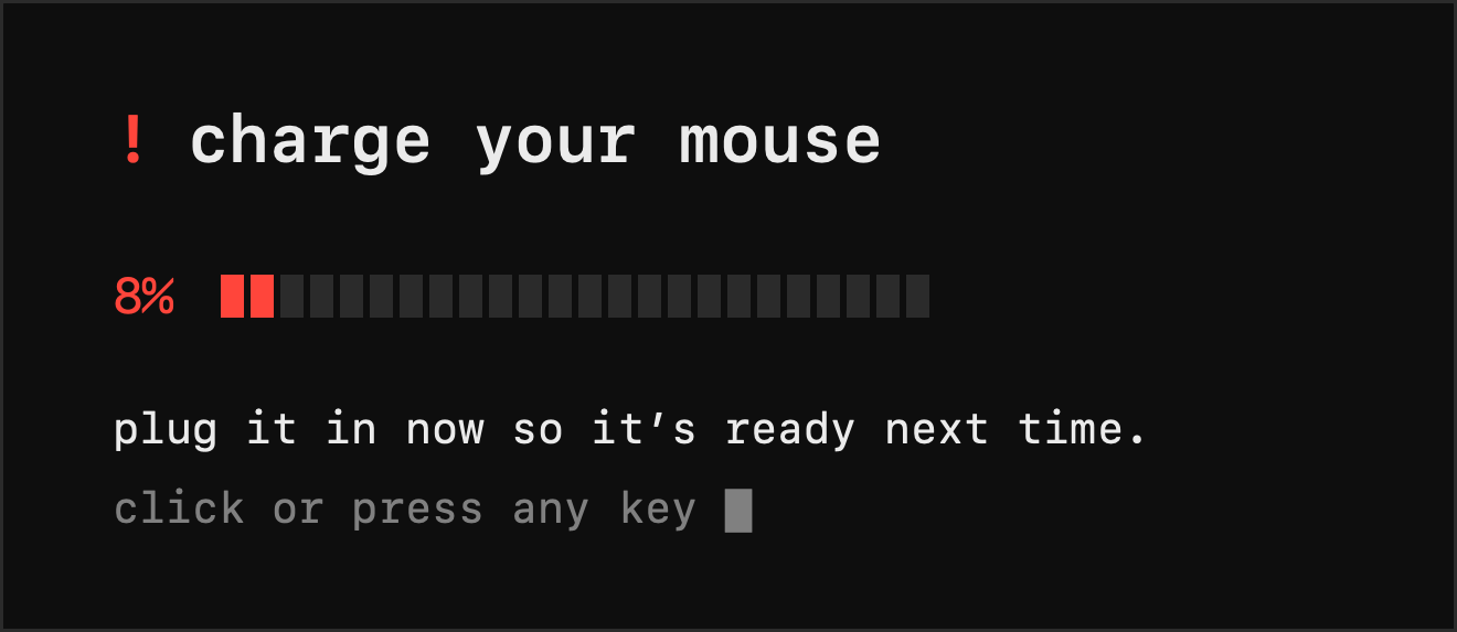 A black card reading: charge your mouse. 8%, with a mostly empty battery bar. Plug it in now so it's ready next time. Click or press any key.
